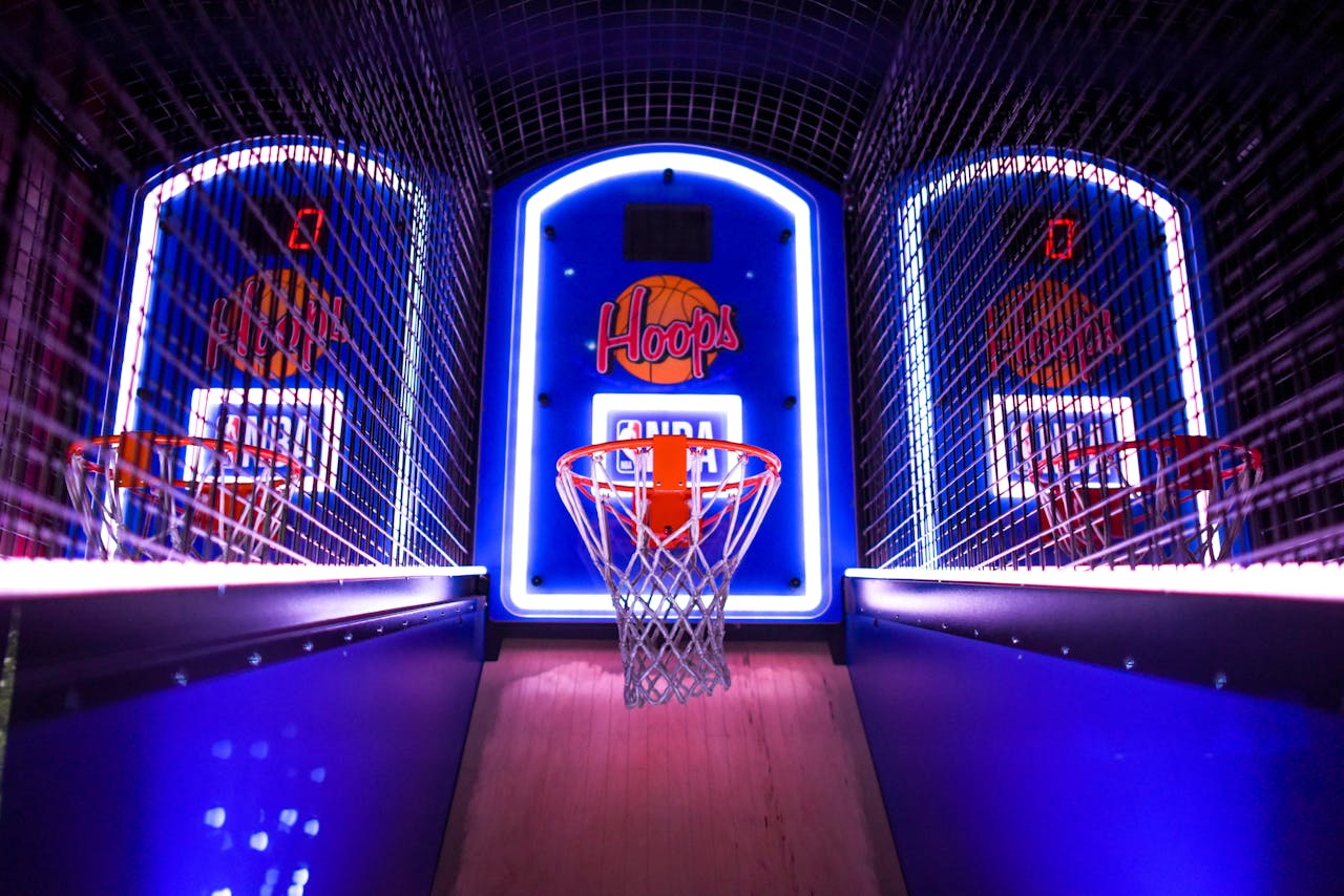 Basketball arcade machine with neon target hoops